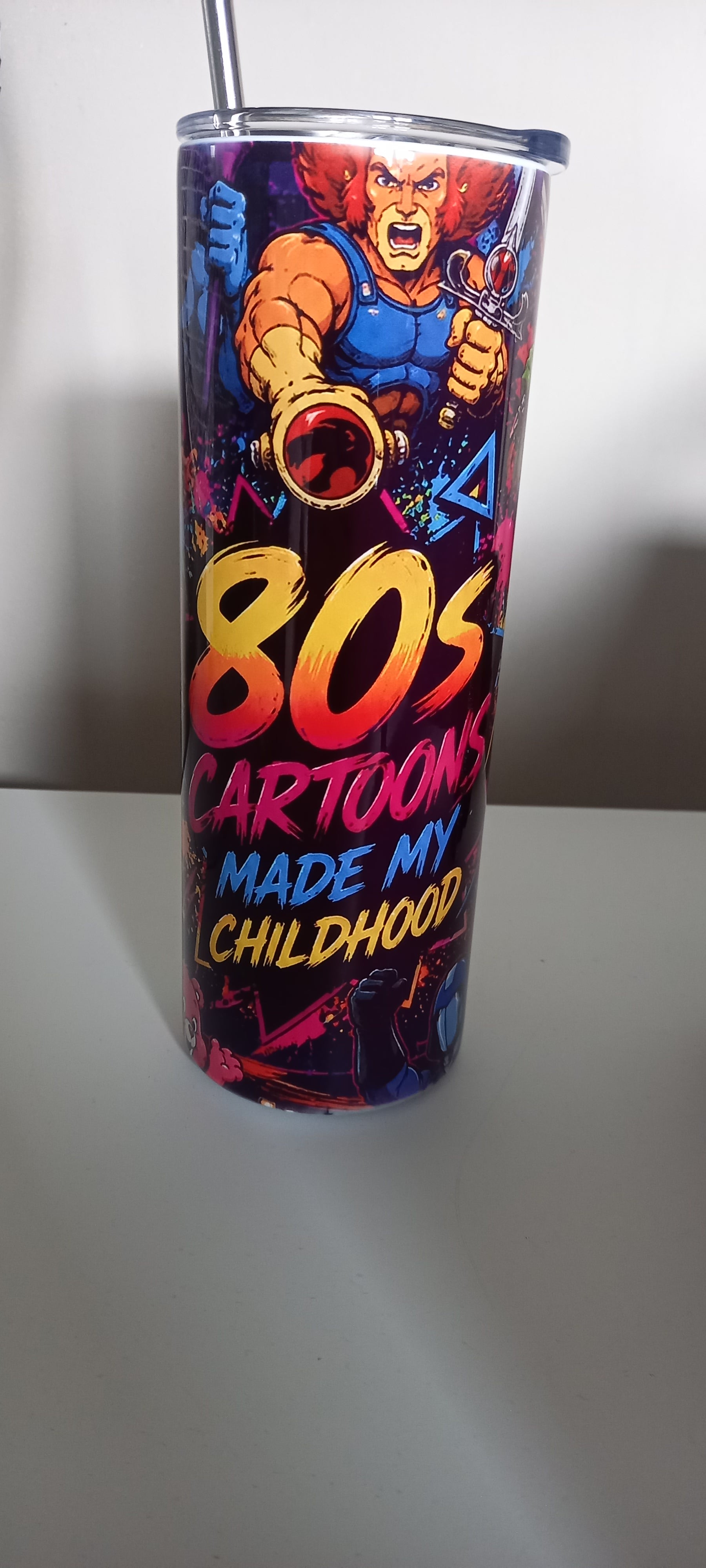 80s Cartoons tumbler showing He-Man, Skeletor and Transformers
