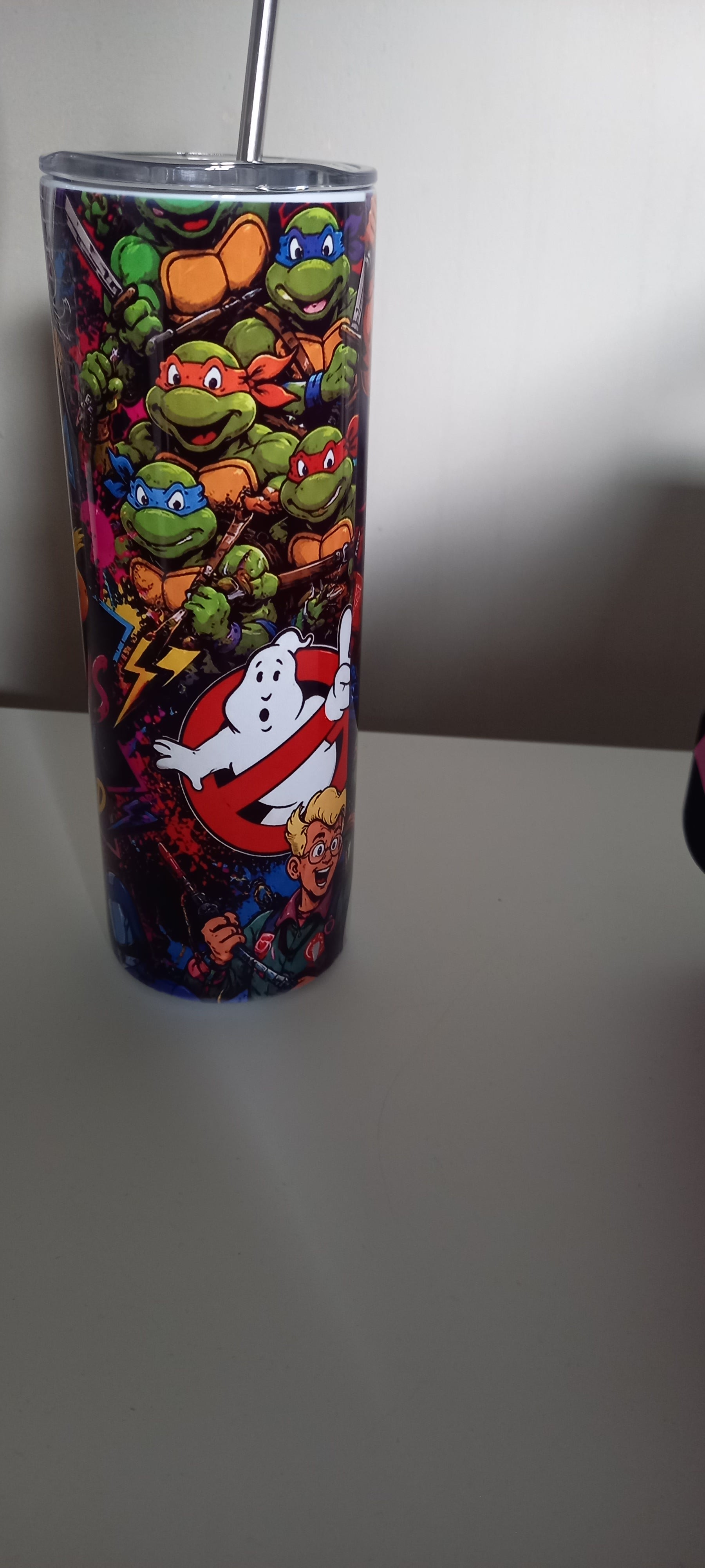 80s Cartoons tumbler showing TMNT and Ghostbusters