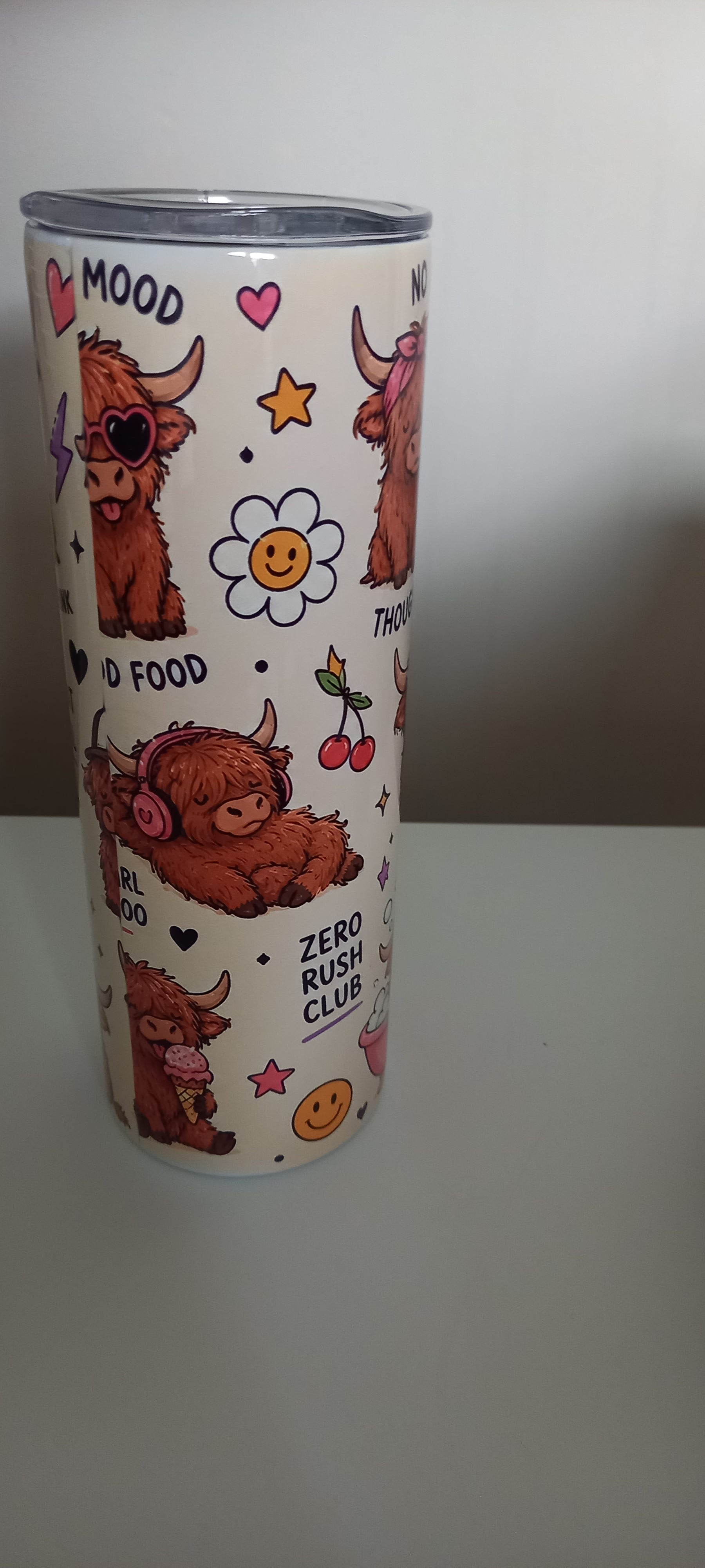 Highland cow tumbler side view showing No Thoughts and Zero Rush Club with cow in bubble bath