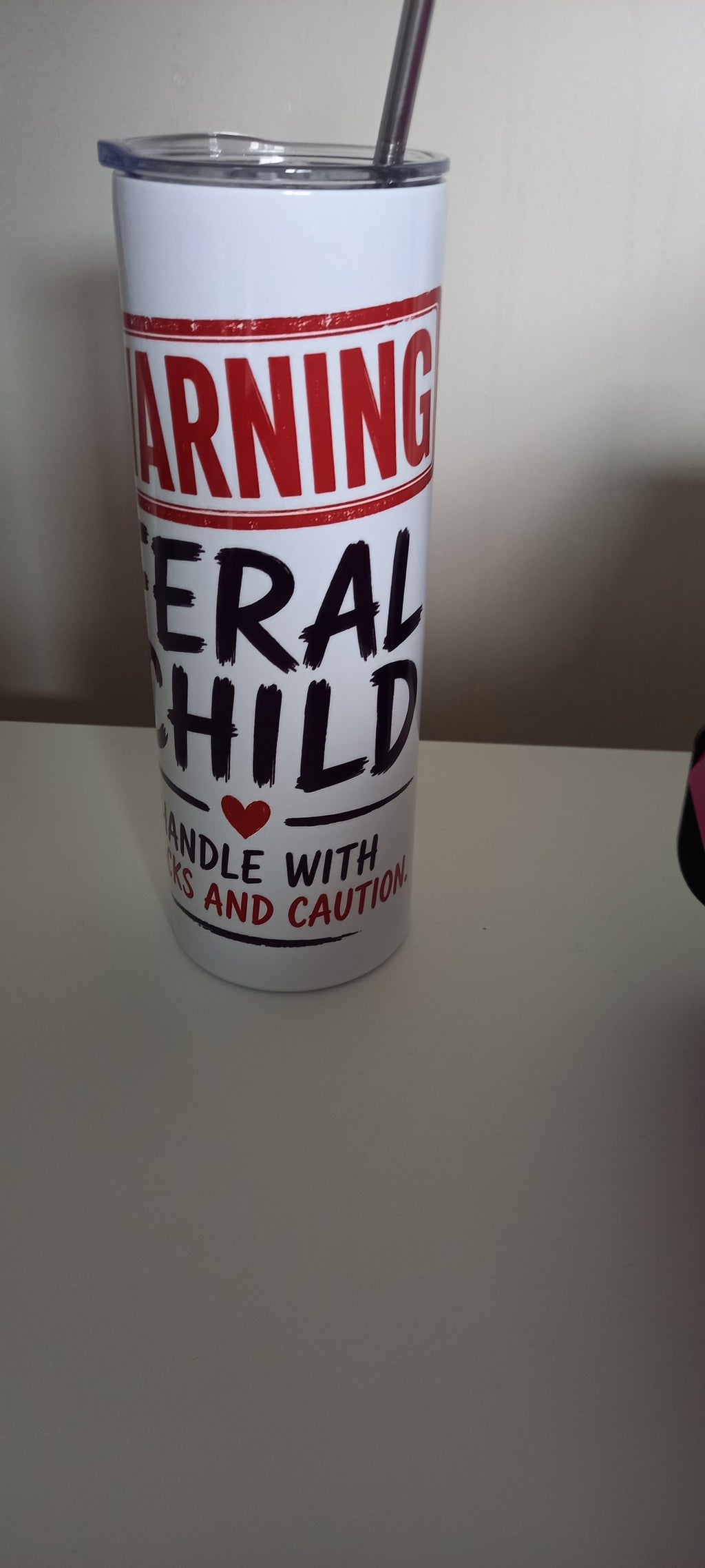 Warning Feral Child tumbler showing Handle with Snacks and Caution text