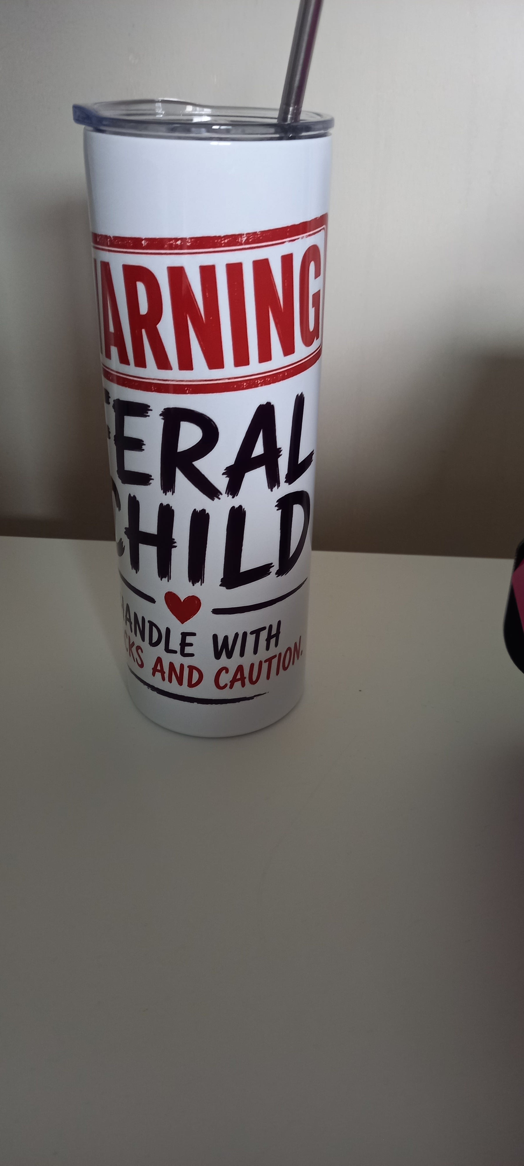 Warning Feral Child tumbler showing Handle with Snacks and Caution text
