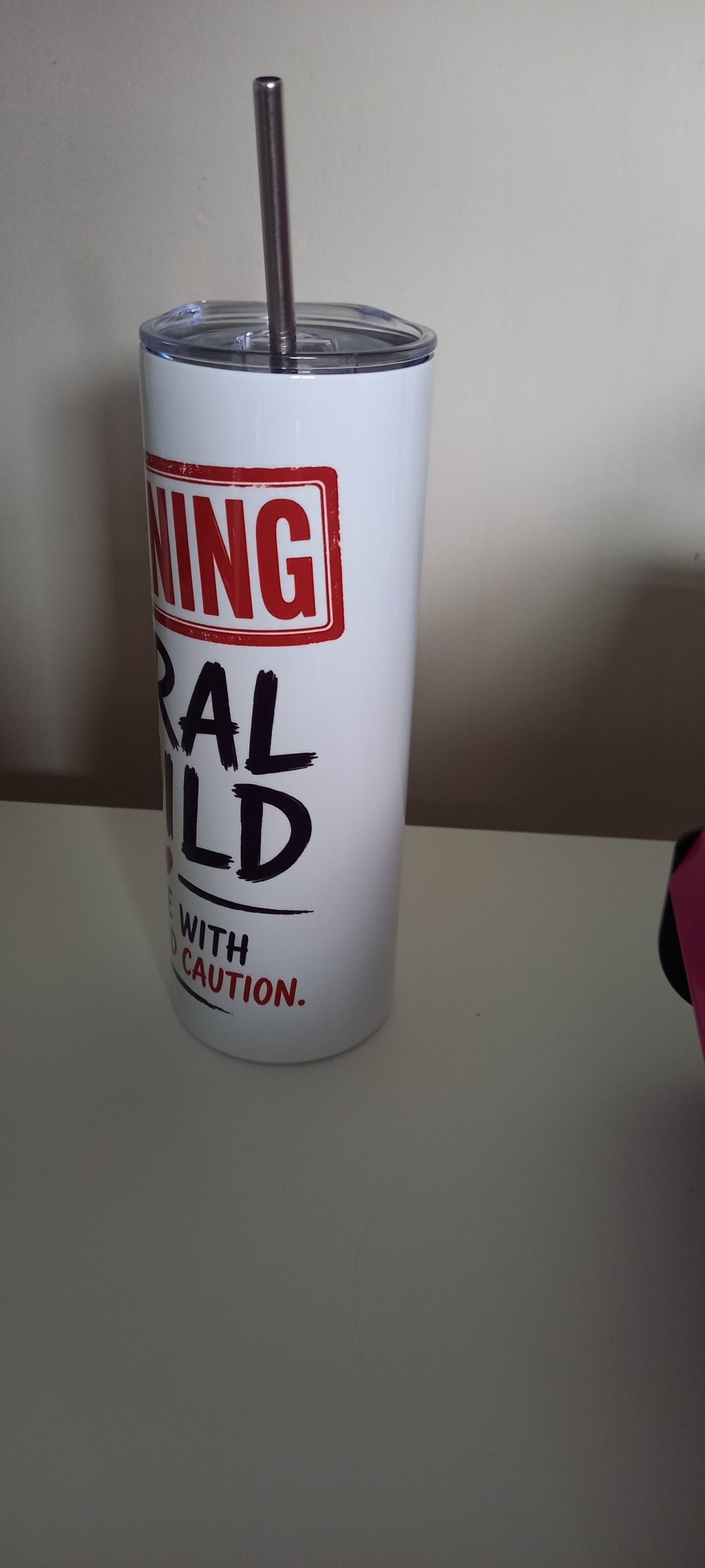 Warning Feral Child tumbler front view showing full text