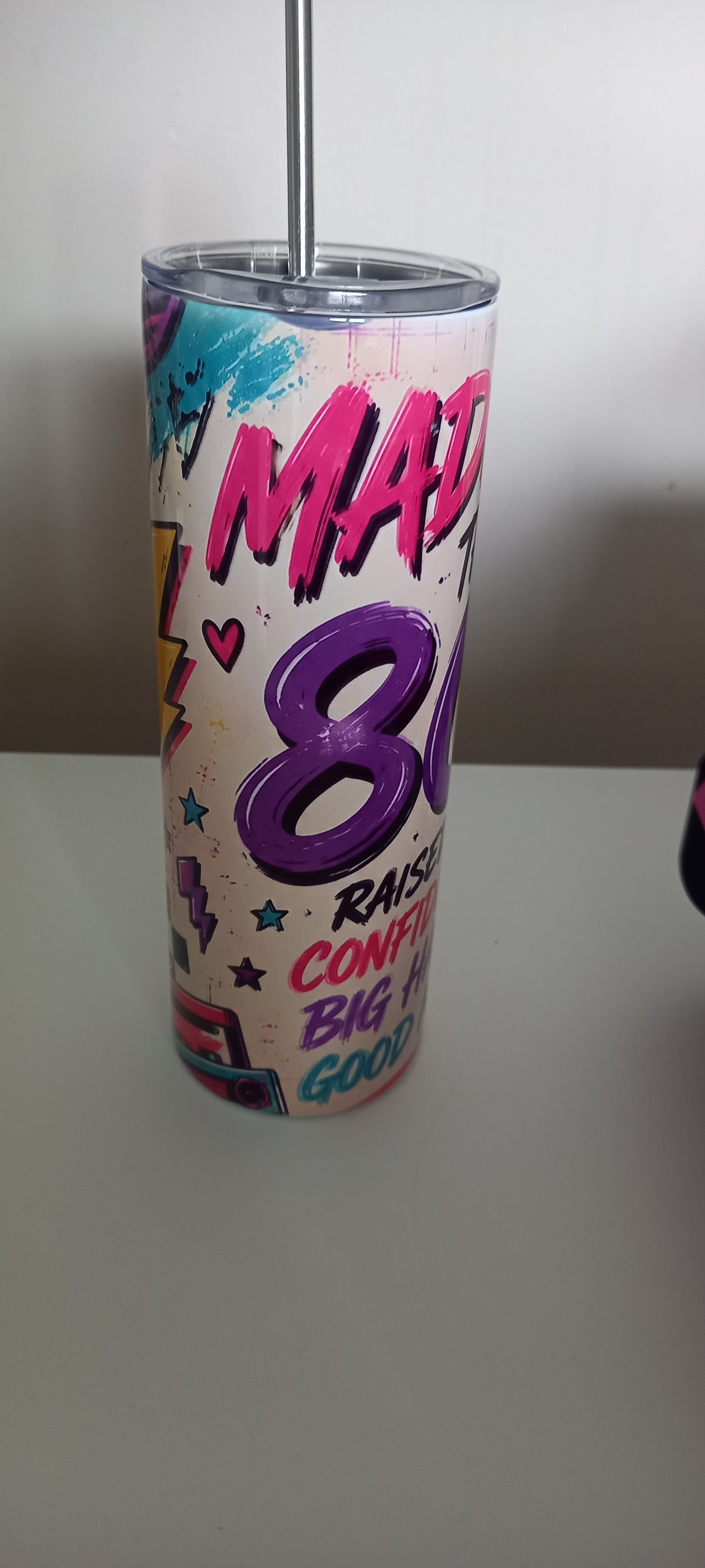 Made in the 80s tumbler front angle view with neon design