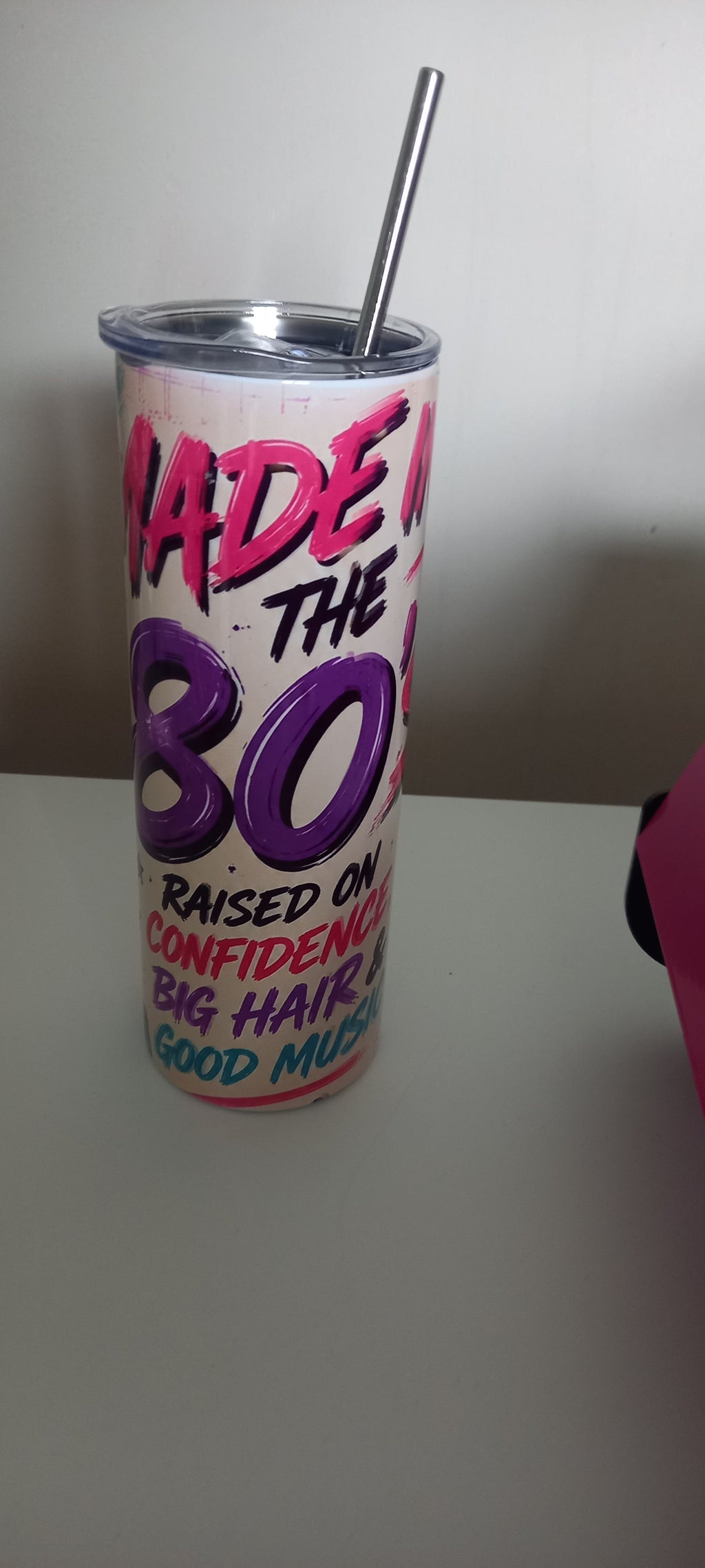 Made in the 80s tumbler showing full text - Raised on Confidence, Big Hair & Good Music
