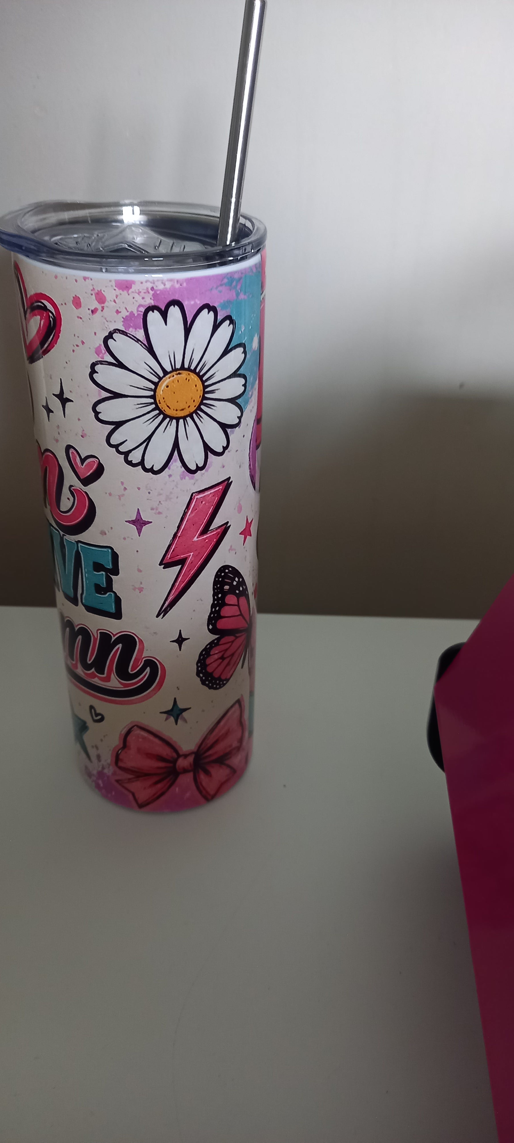 Too Glam to Give a Damn tumbler side view showing daisy, butterfly, lightning bolt and bow accents