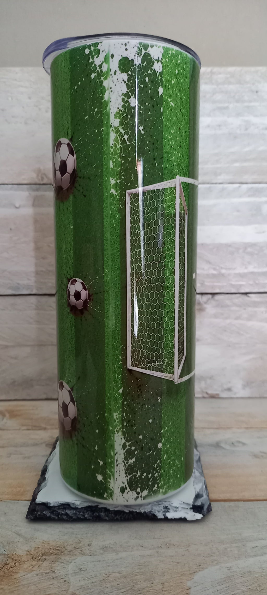 Football tumbler showing goal and pitch design