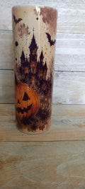 Stainless steel tumbler with haunted castle, jack-o-lantern and bats Halloween design on cream background
