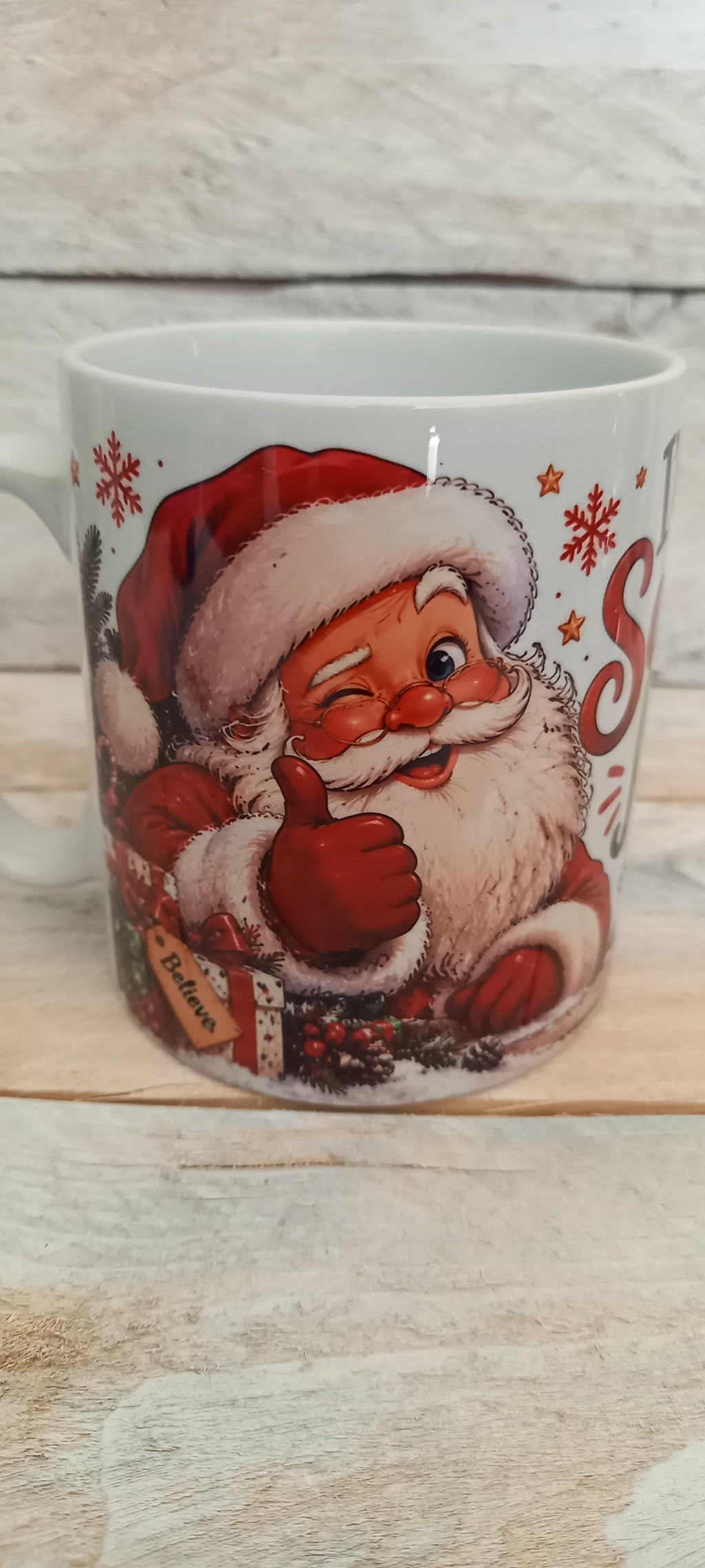 I'm on Santa's Nice List Christmas Mug - jolly Santa thumbs up side